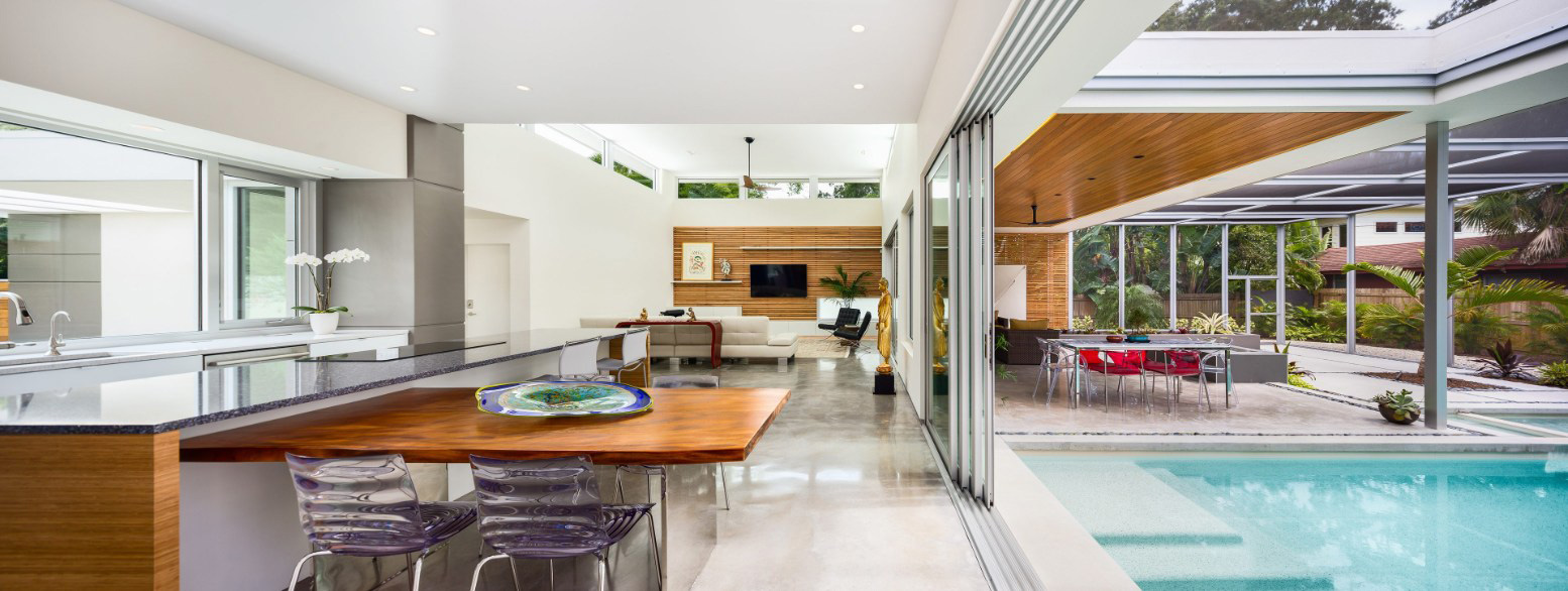 PGT stacking glass doors allow Sarasota homes to open for entertaining effortlessly.