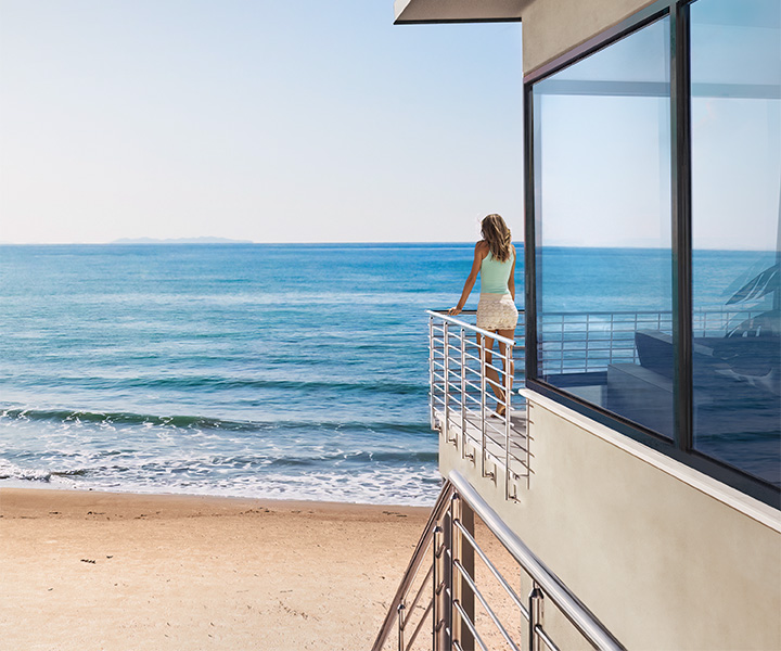 PGT energy-efficient windows installed in a luxurious Sarasota home, showcasing superior insulation and UV protection for optimal comfort and reduced cooling costs in Florida's warm climate.